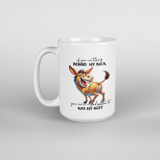 A white coffee mug with a donkey on it that says If you are talking behind my back you are in a good position to kiss my butt