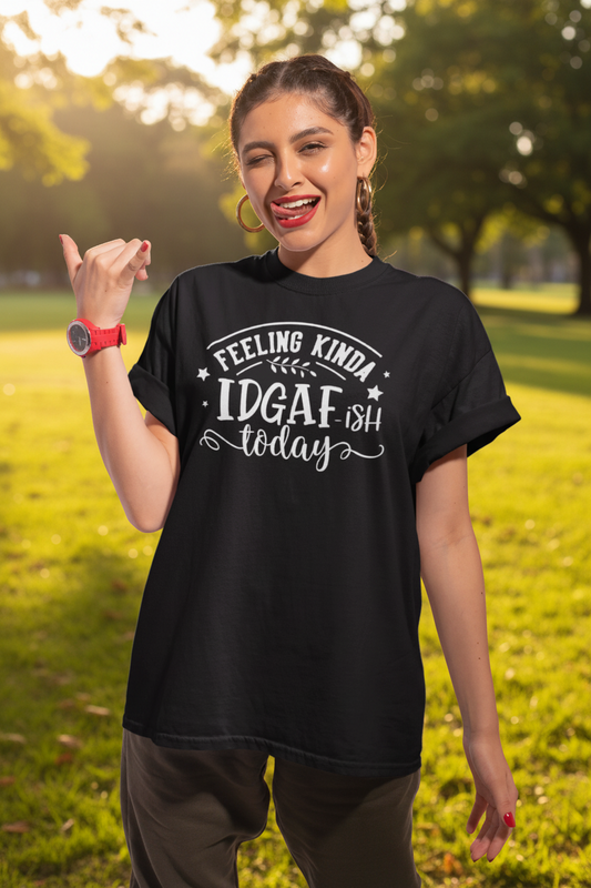 A young woman doing a surf hand sign while wearing a black t shirt with white writing that says Feeling Kinda IDGAF ish today