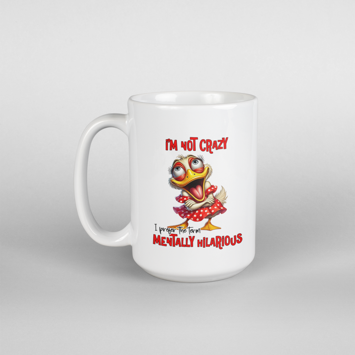 A white coffee mug with a female cartoon duck crossing her arms and saying I'm not crazy I prefer the term mentally hilarious