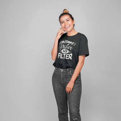 A happy woman wearing flared jeans and a black t shirt with white writing caution I have no filter